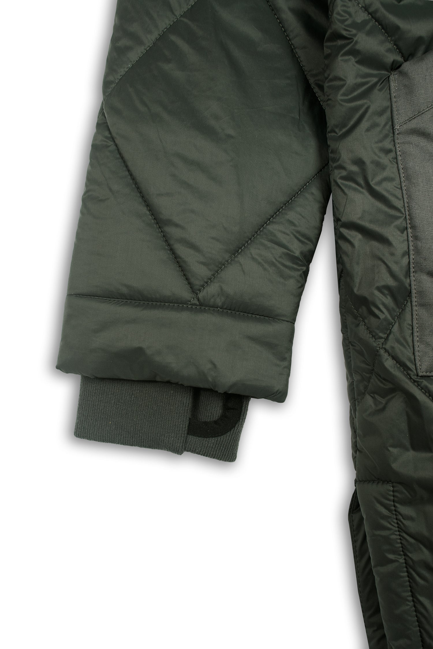 Sustainable army green oversized hemp puffer coat made from 100% deadstock fabrics. Featuring a soft lightweight insulation made from certified recycled PET from Repreve® that is 100% vegan and cruelty-free. Detail View Cuffs
