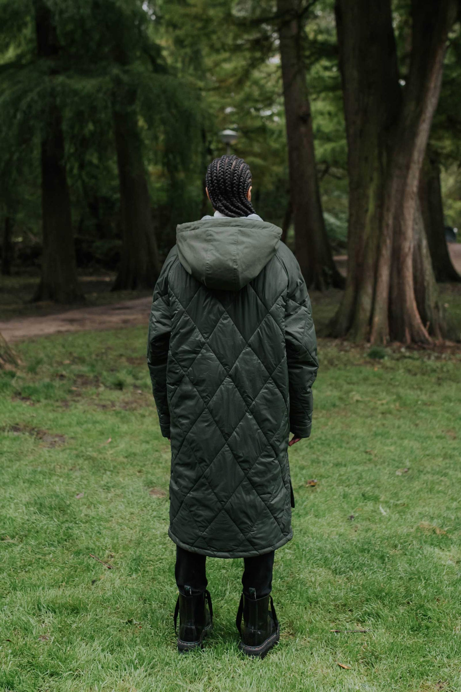 Sustainable army green oversized hemp puffer coat made from 100% deadstock fabrics. Featuring a soft lightweight insulation made from certified recycled PET from Repreve® that is 100% vegan and cruelty-free. Back View
