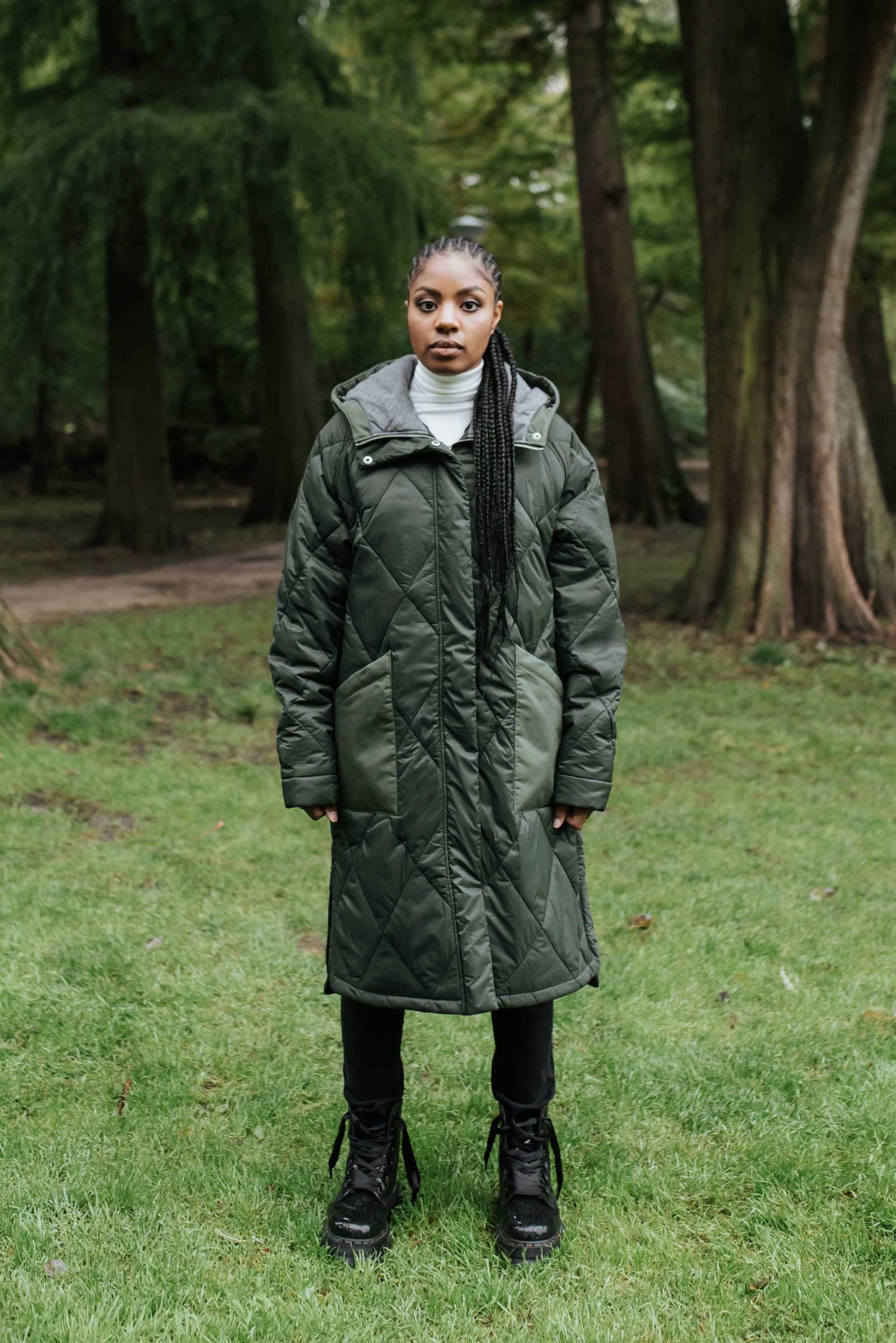 Sustainable army green oversized hemp puffer coat made from 100% deadstock fabrics. Featuring a soft lightweight insulation made from certified recycled PET from Repreve® that is 100% vegan and cruelty-free. Front View