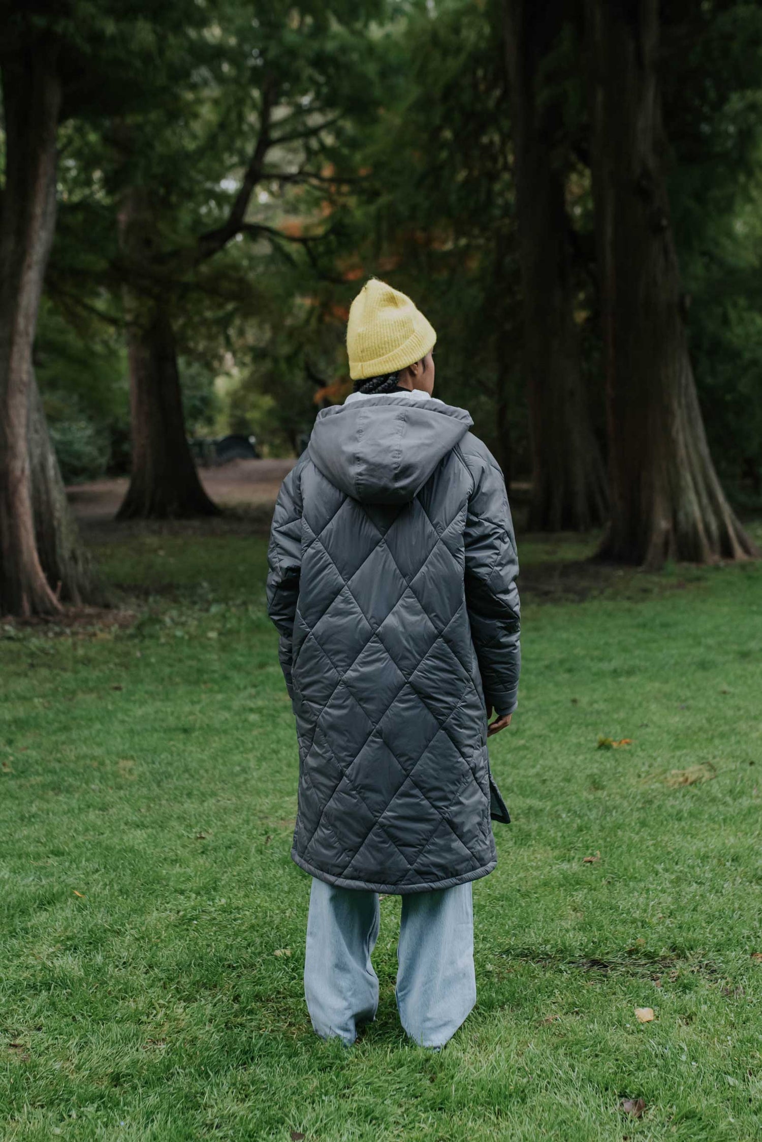 Sustainable cool grey oversized hemp puffer coat made from 100% deadstock fabrics. Featuring a soft lightweight insulation made from certified recycled PET from Repreve® that is 100% vegan and cruelty-free. Back View