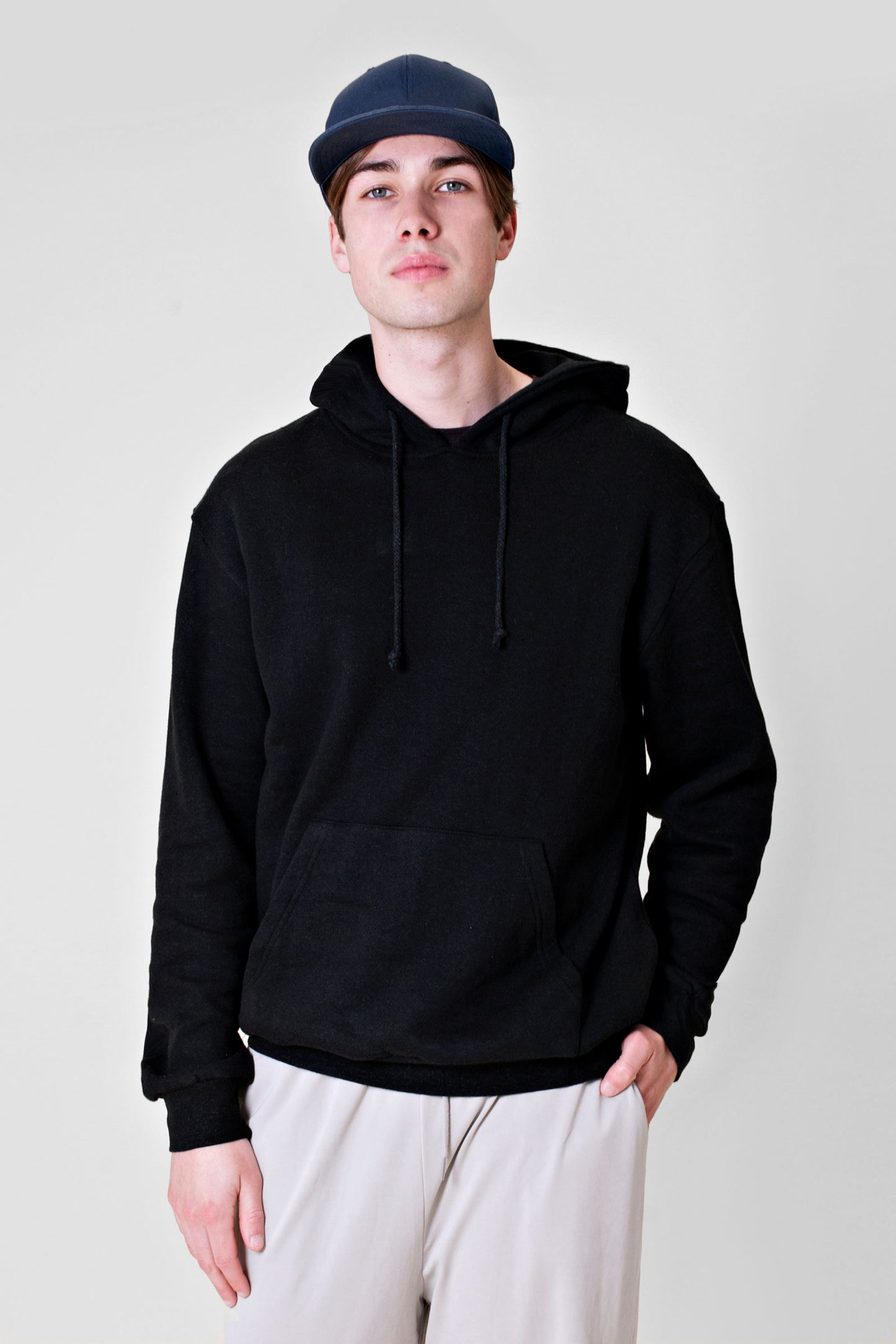 Experience the ultimate comfort of this soft combed hemp and organic cotton fleece hooded sweatshirt in black.