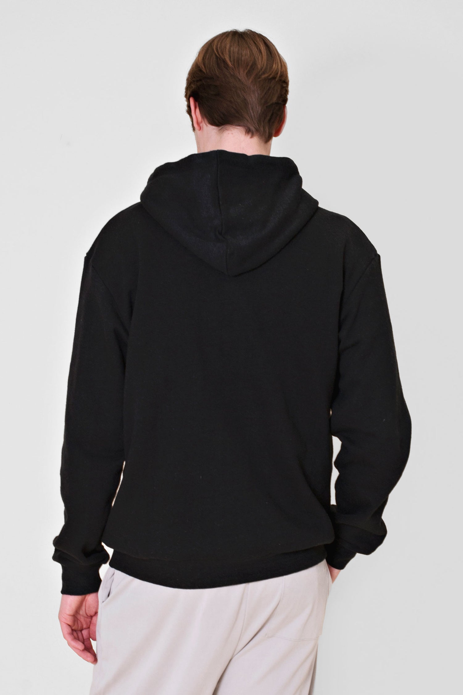 Experience the ultimate comfort of this soft combed hemp and organic cotton fleece hooded sweatshirt in black.