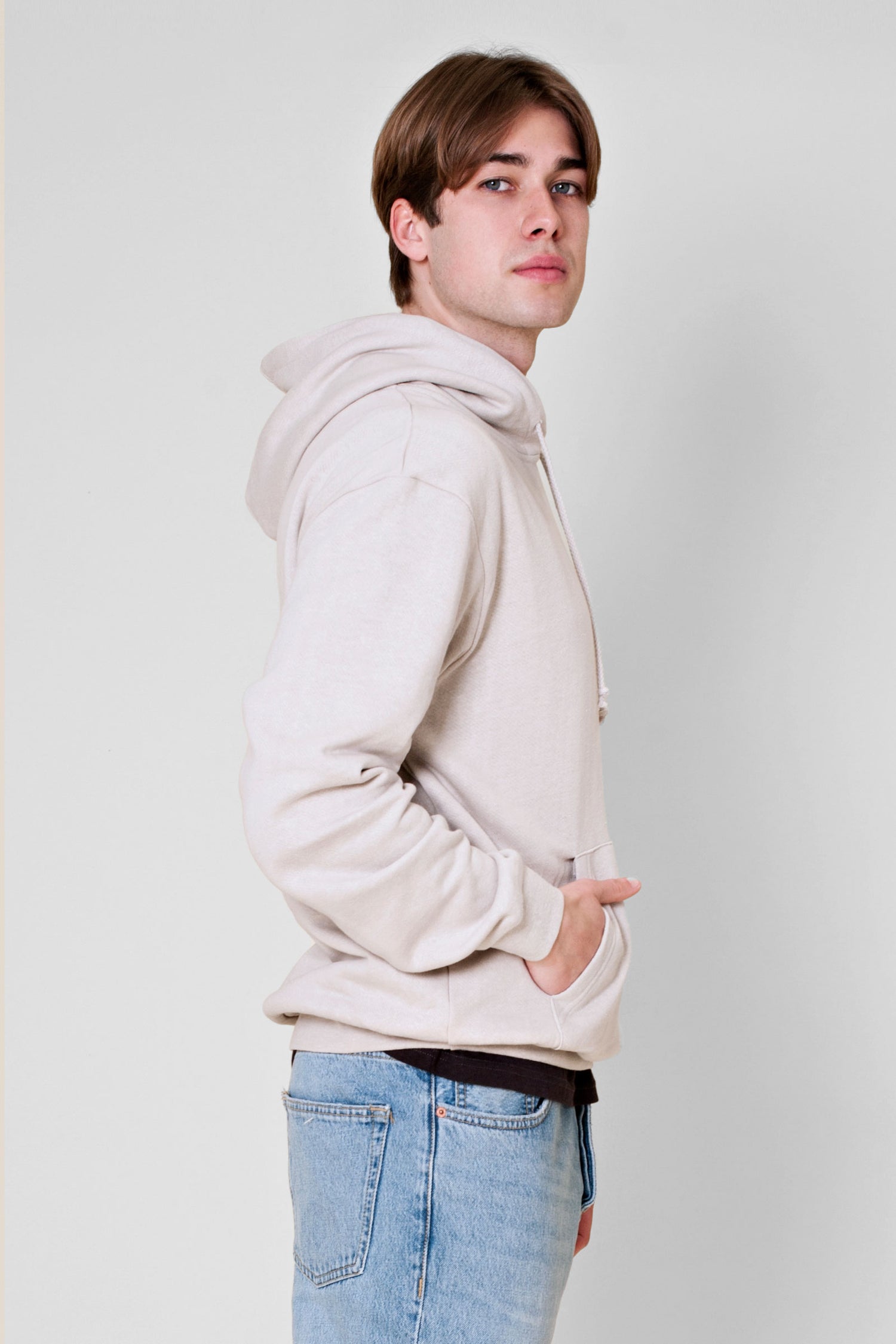 Experience the ultimate comfort of this soft combed hemp and organic cotton fleece hooded sweatshirt in a muted concrete color.