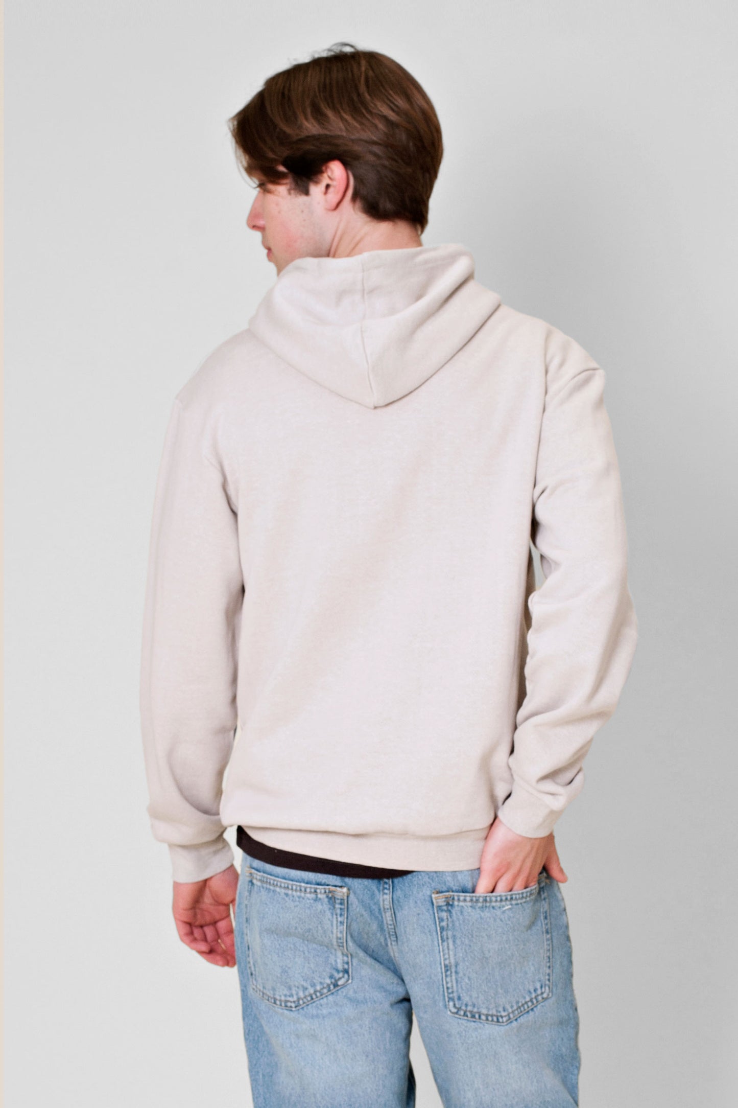 Experience the ultimate comfort of this soft combed hemp and organic cotton fleece hooded sweatshirt in a muted concrete color.
